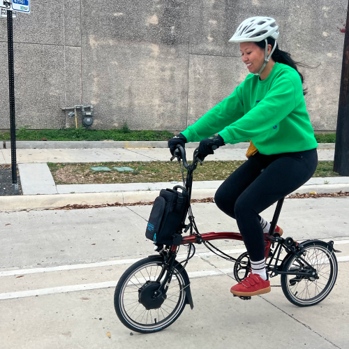 A woman riding a bike