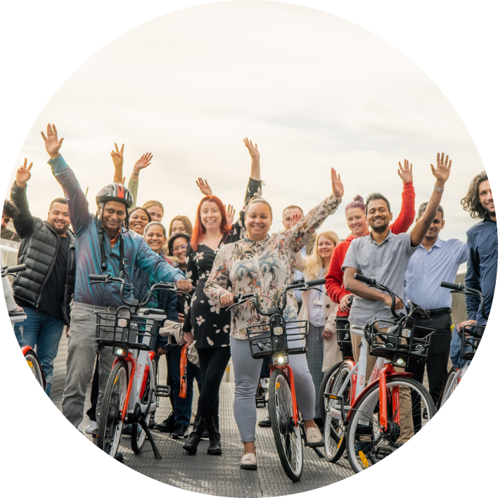 People on a bridge with bikes